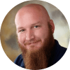 Professional headshot of Jeremiah E. Altepeter, Software Engineering Manager, smiling at the camera